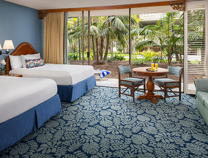  Studio room at the Catamaran Resort Hotel and Spa in San Diego beaches featuring a patio that opens up to the lush tropical gardens.