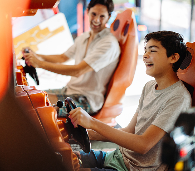 Boy and dad enjoy playing video game