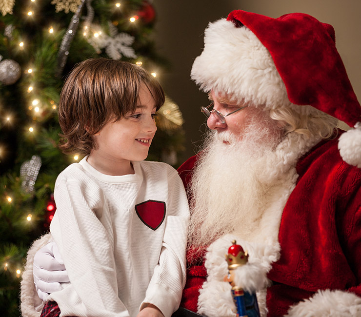 Child visiting with Santa Claus at the at the Catamaran Resort Hotel in Pacific Beach San Diego